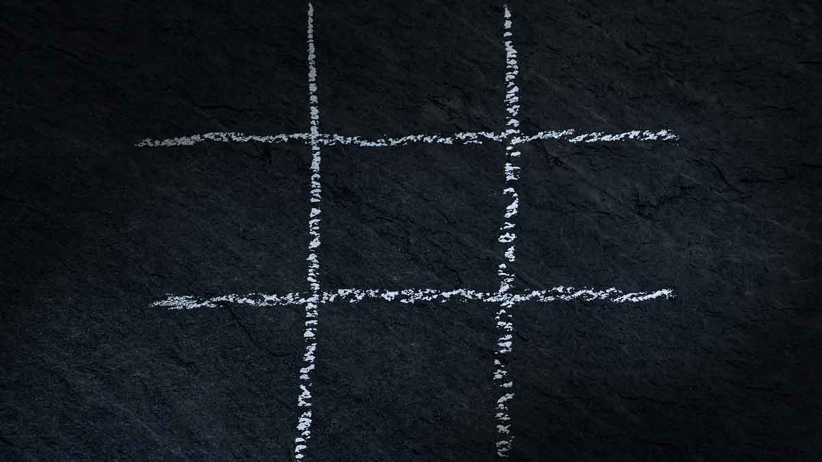 tic-tac-toe grid on chalkboard.